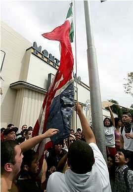 US Flag Hung upsidedown under American Flag. Boycott Absolut Vodka